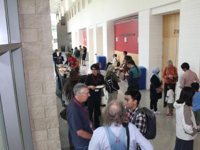 CCCG event photos - long hallway with participants