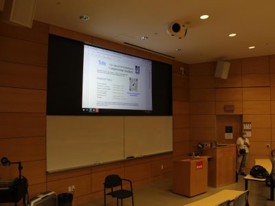 CCCG event photos - lecture hall with speaker slide