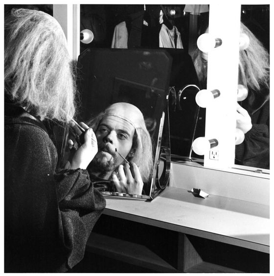 Photo of David MacKenzie applying theatre makeup for a production of Hamlet in 1970