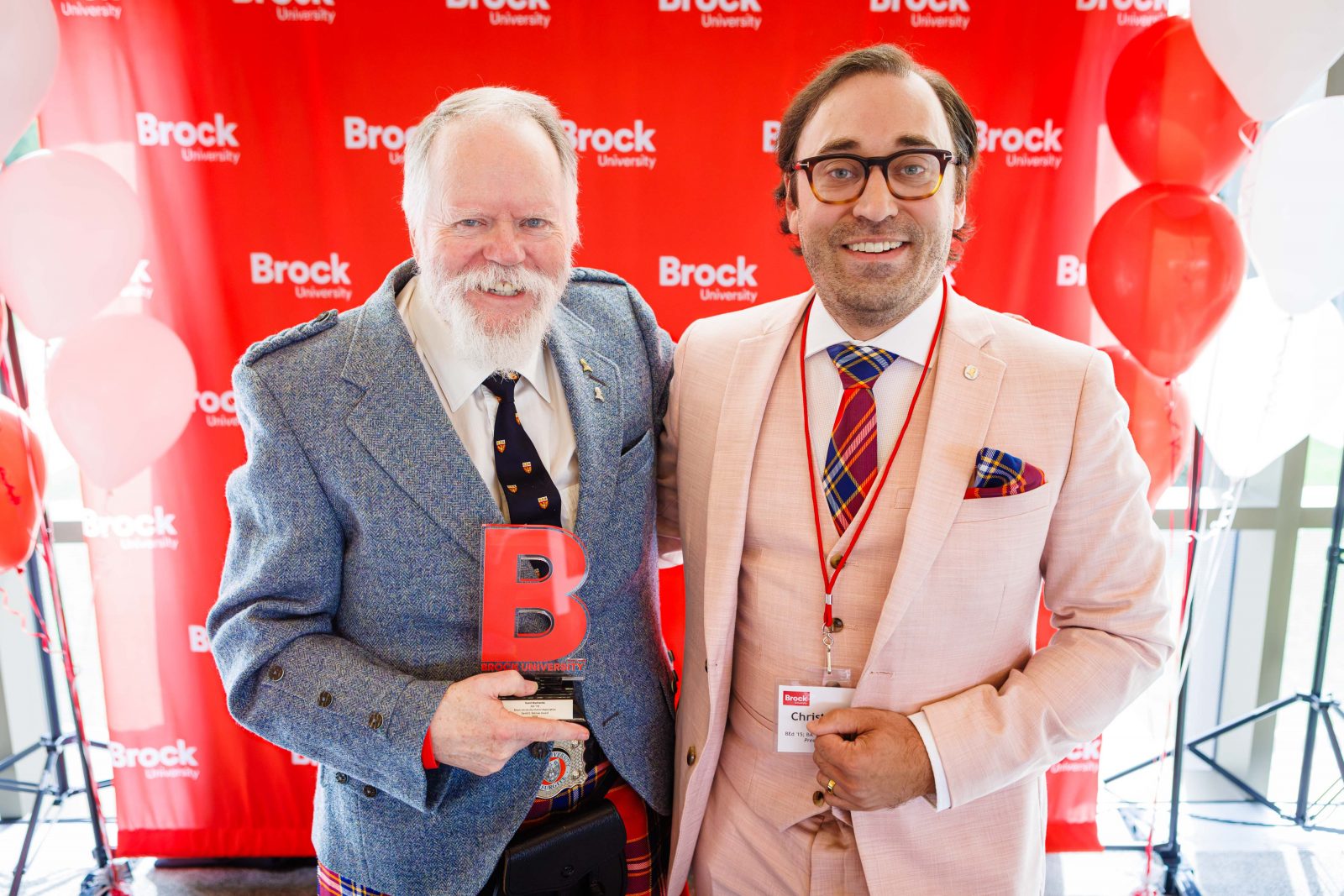 Photo of David Mackenzie accepting the David Betzner Award during the 2026 Alumni Awards Celebration