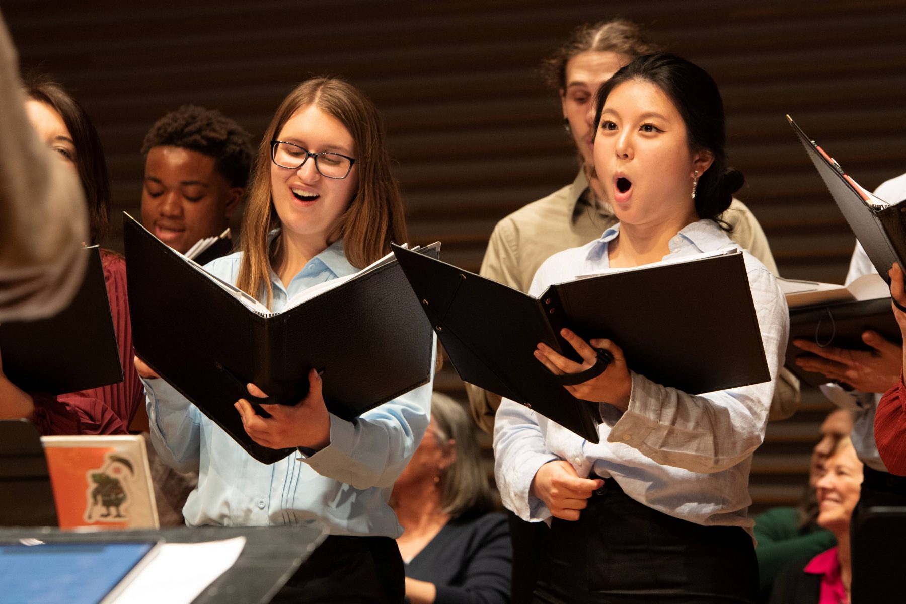 Photo of students singing in a choir workshop.