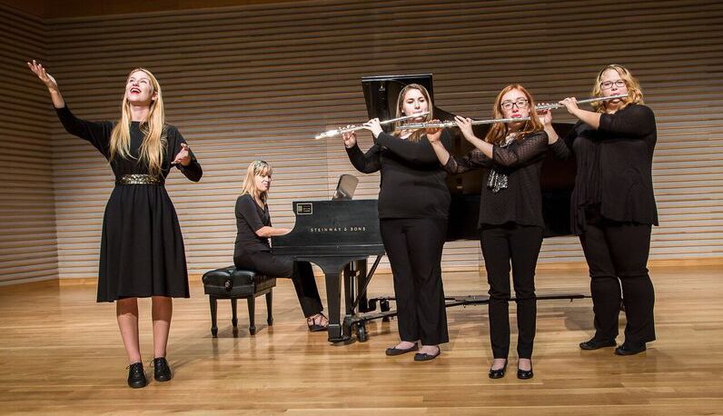 pianist with 3 flute players while woman sings