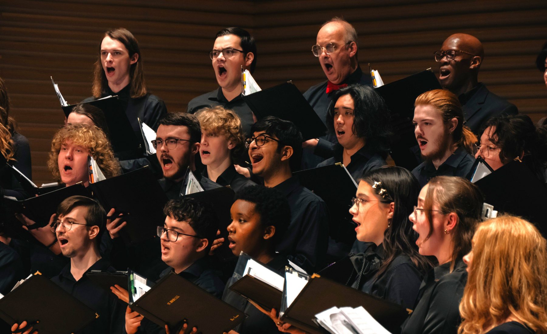 Photo of Brock Choir singing on stage. 