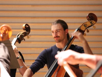 String Orchestra practicing cellist