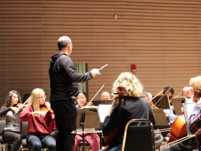 String Orchestra playing in front of conductor