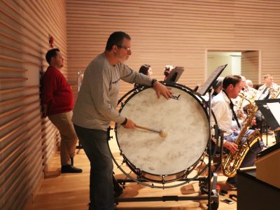 Wind Ensemble Drummer behind wind instruments practicing