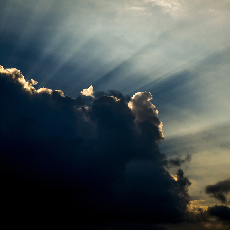sun rays through storm clouds