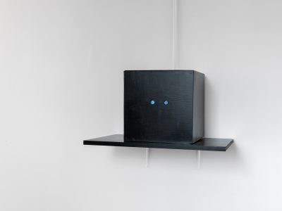 black bocx on a black shelf