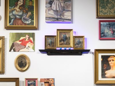 group of ornate framed artwork on wall