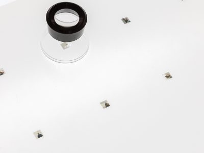 tiny portarait photos on light table and a loop