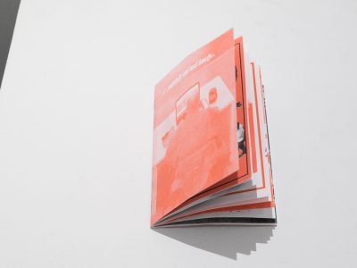 orange book pages slightely opened on table