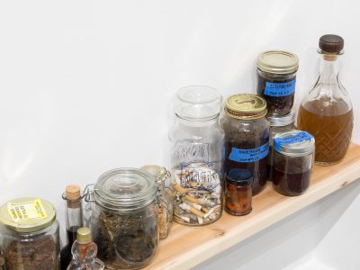 various sized jars and bottles on shelf