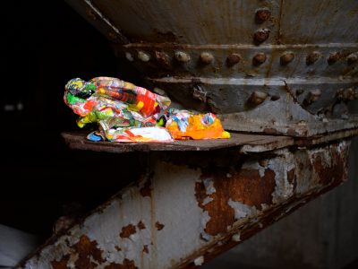 multi coloured sculpture on an industrial machine