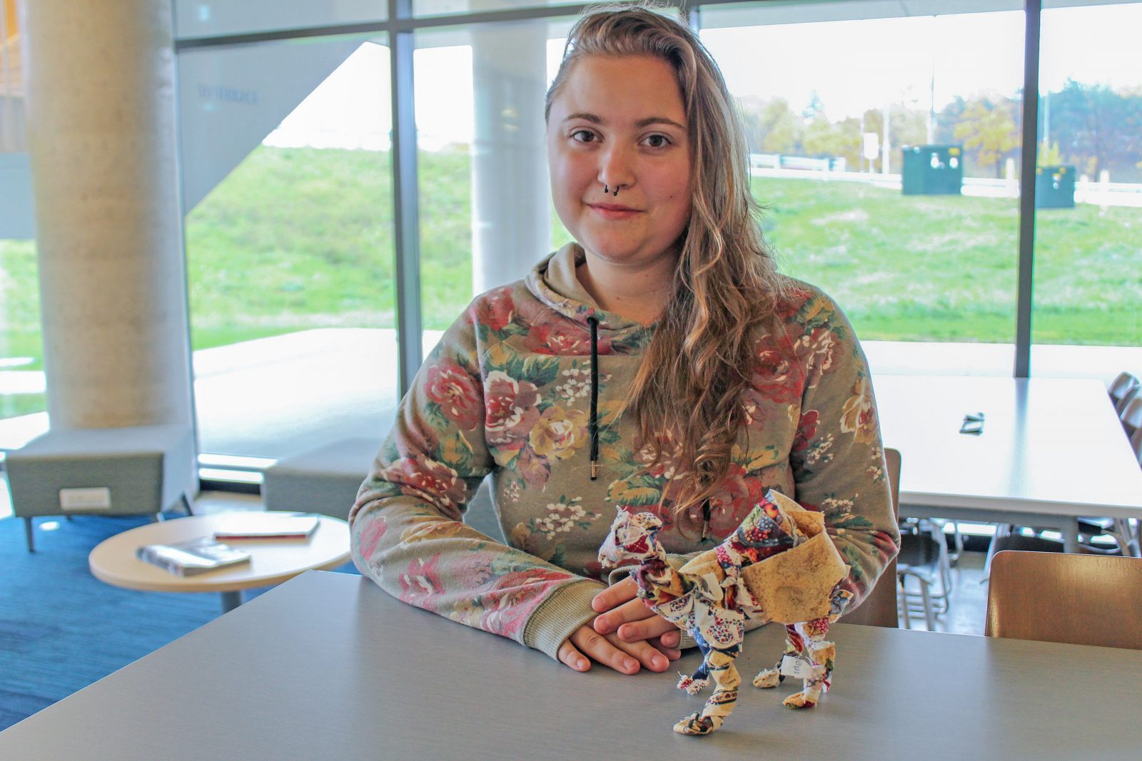 Brock Visual Arts student Emma Mary with Sculpture of Llama from scrap fabric.
