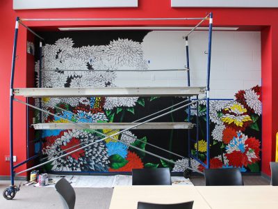 Fourth-year Visual Arts student Chardon Trimble-Kirk mural in progress