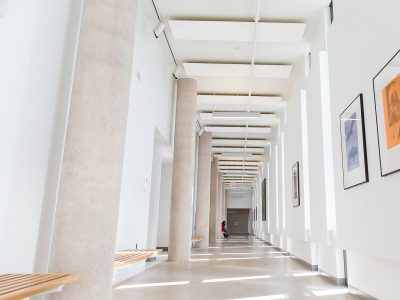 hallway with 2 colourful paintings on wall