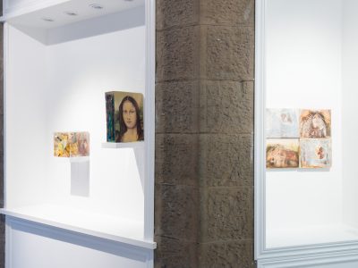 interior view of gallery with a group of painted portraits
