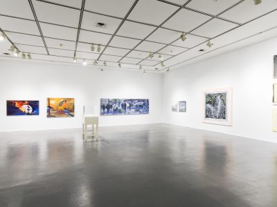 interior view of artwork hanging on gallery wall