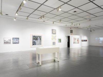 interior view of artwork hanging on gallery wall