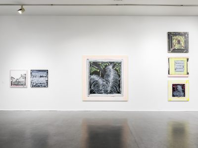 interior view of artwork hanging on gallery wall