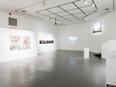 interior view of artwork hanging on gallery wall