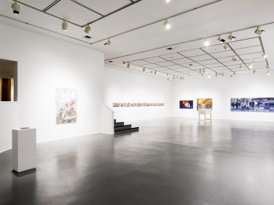 interior view of artwork hanging on gallery wall
