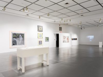 interior view of artwork hanging on gallery wall