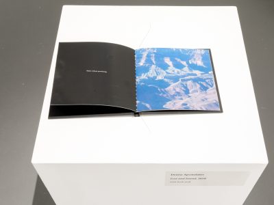 open book with a black page and one of a closeup of water