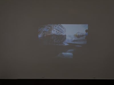 artwork prjected on a dark wall