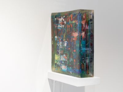 rectangular colourful sculpture on a shelf