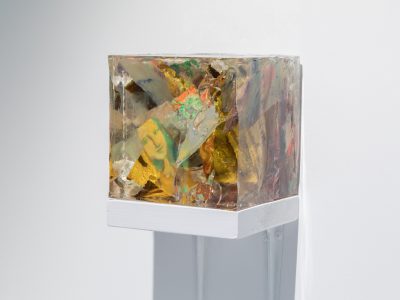 Cubed colourful sculpture on a shelf