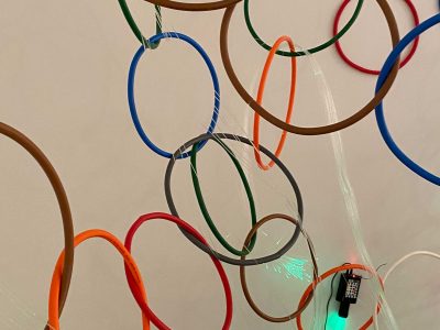 coloured hoops and lit fibre cable close up