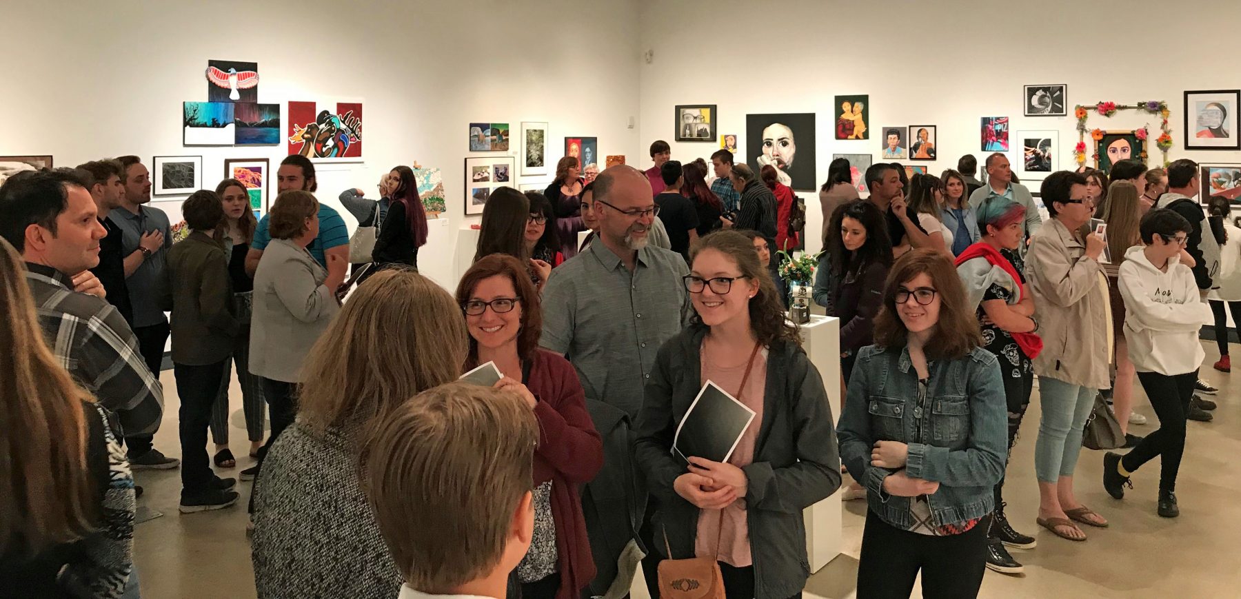 Art gallery full of atendees