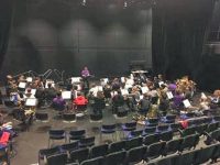 musicians rehearsing on stage