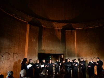 choir singers inside of an industrial building