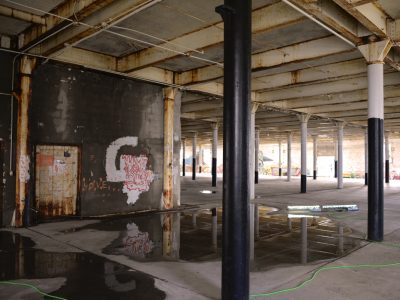 interior view of an industrial building filled with metal pillars