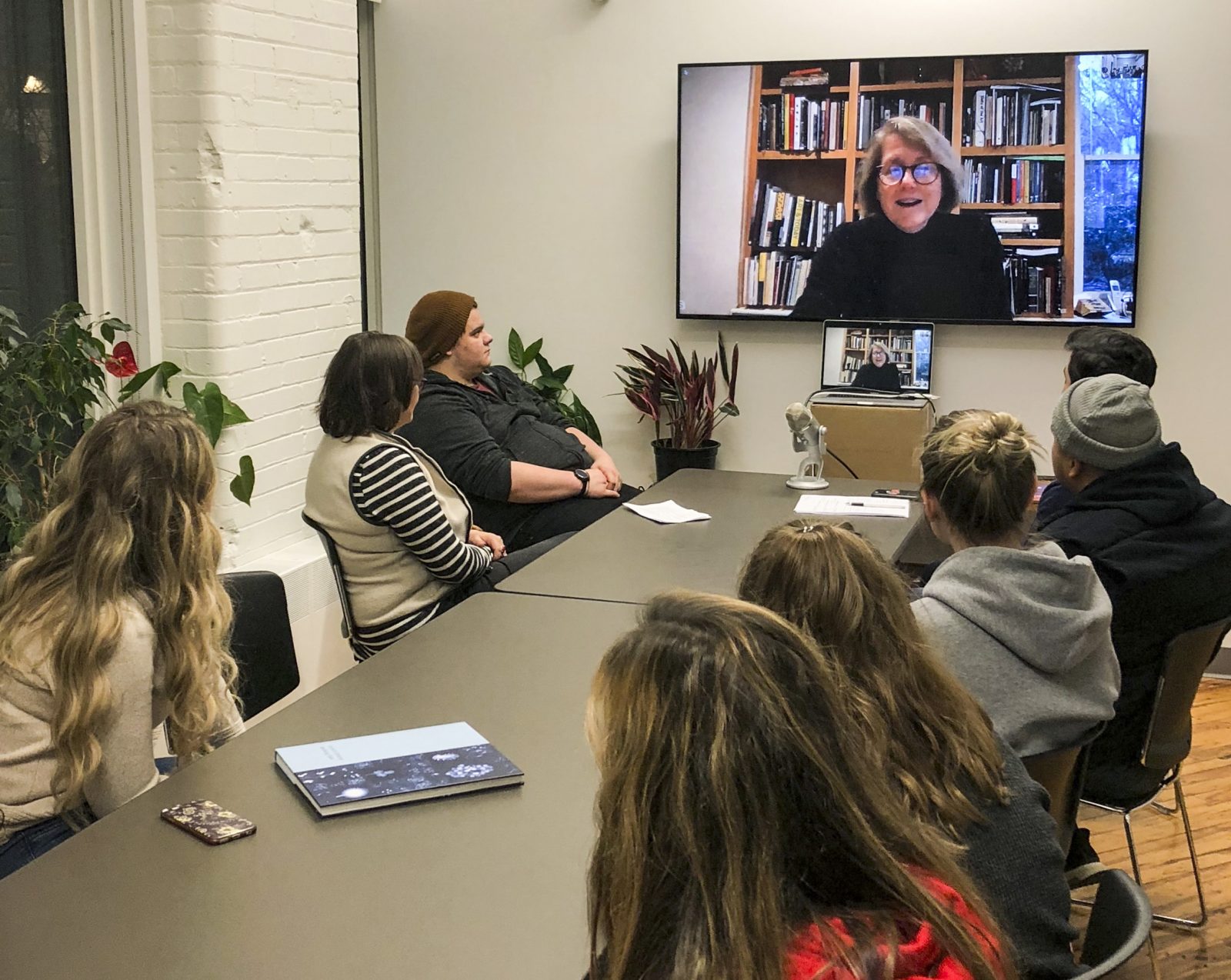 Dornith Doherty on screen with students in room looking at screen