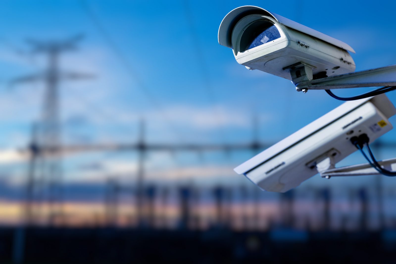 Security camera over blue sky