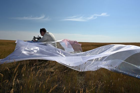 Grasslands-Sewing-3049-mid-sz Photo of Wally Dion sewing organza on a sewing machine in the grasslands.