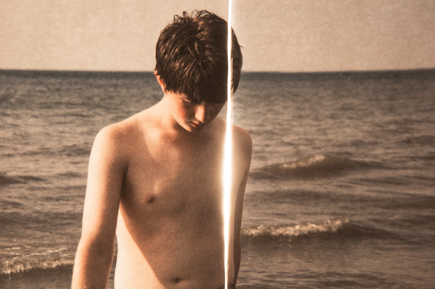 Wayfinding in Cold Light from the Multi-Verse Series” by Amy Friend picture of young boy shirtless at beach