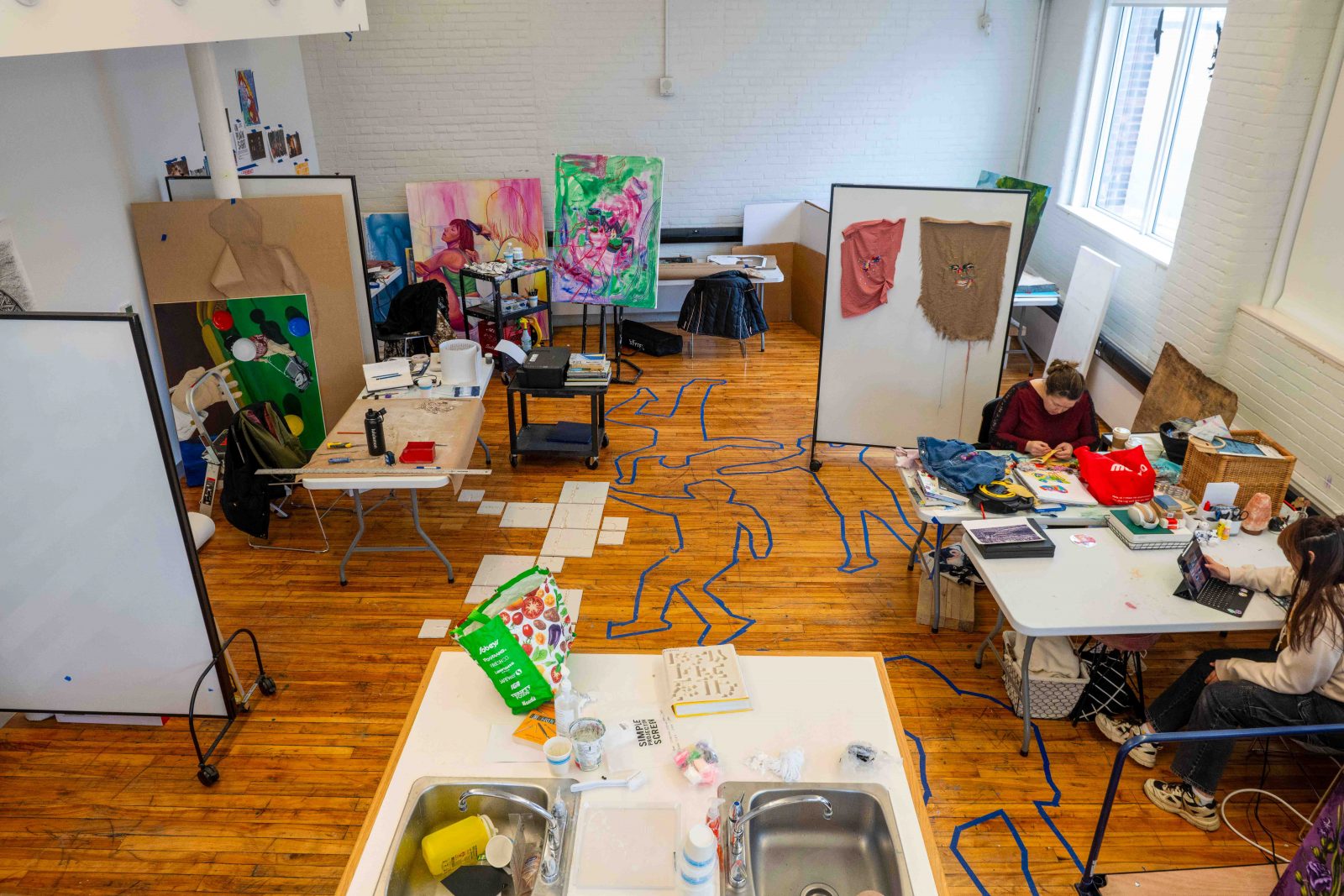 Photo of students working in 5th floor studio.