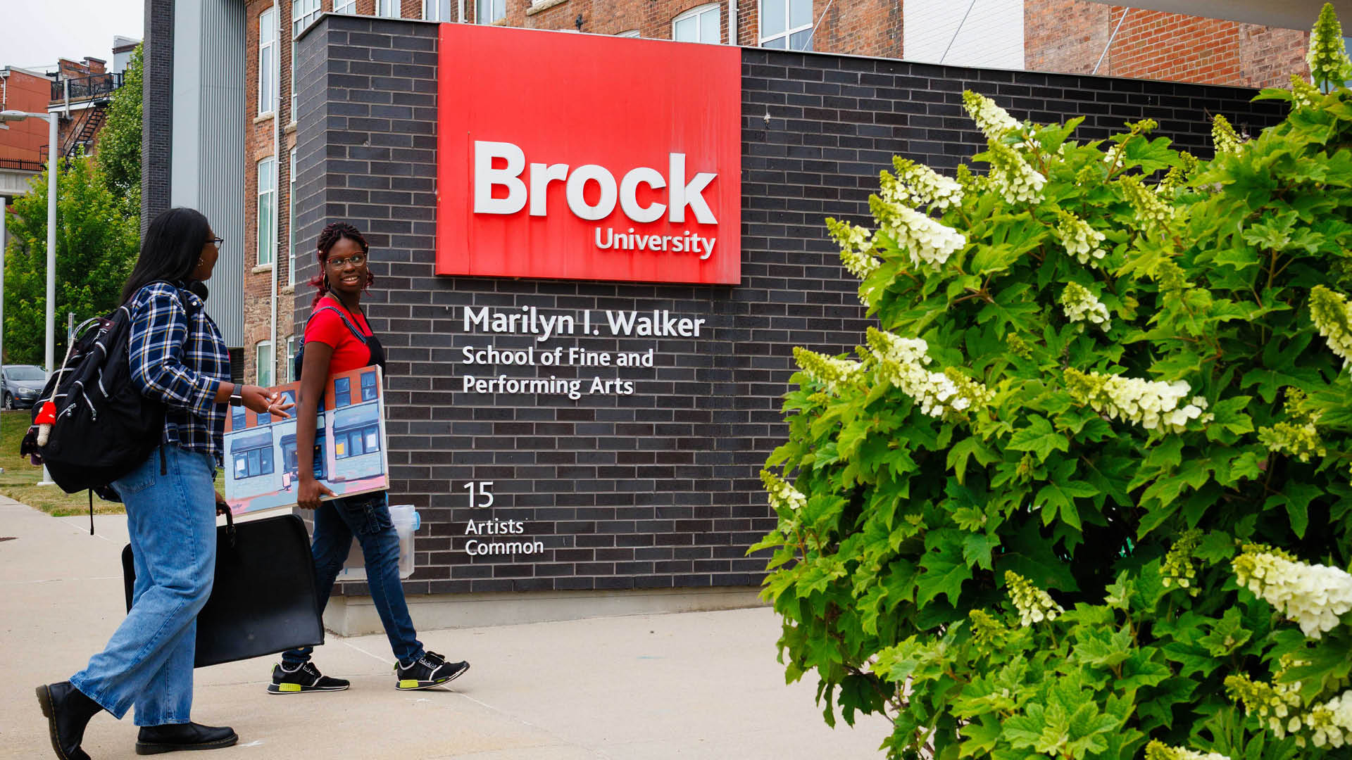 Two Brock students enter the Marilyn I. Walker School of Fine & Performing Arts. 