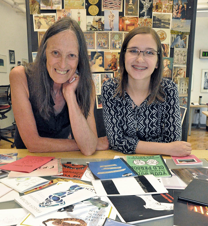 Lesley Bell and Victoria Reid at table of magazines