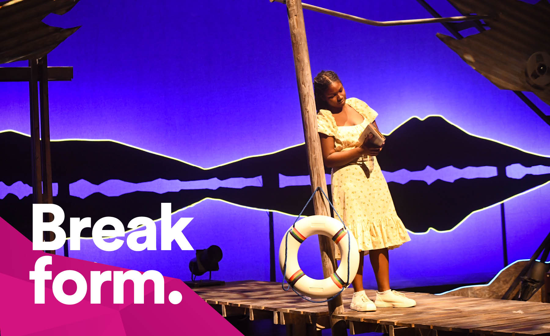 Photo of DART student at Mainstage production with slogan "Break form".