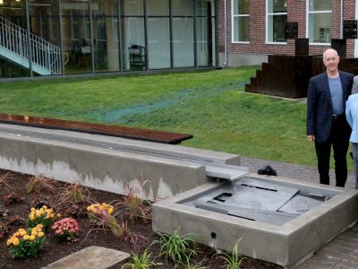 Rotary Club of St. Catharines members George Darte, Liz Palmieri, with Mayor Walter Sendzik,and Brock University Dean of Humanities Carol Merriam, Interim President Tom Traves, back middle, and Vice President of Administration Brian Hutchings, at the unveiling of the new Rotary Reflecting Pool water feature at the Marilyn I. Walker School of Fine and Performing Arts.
