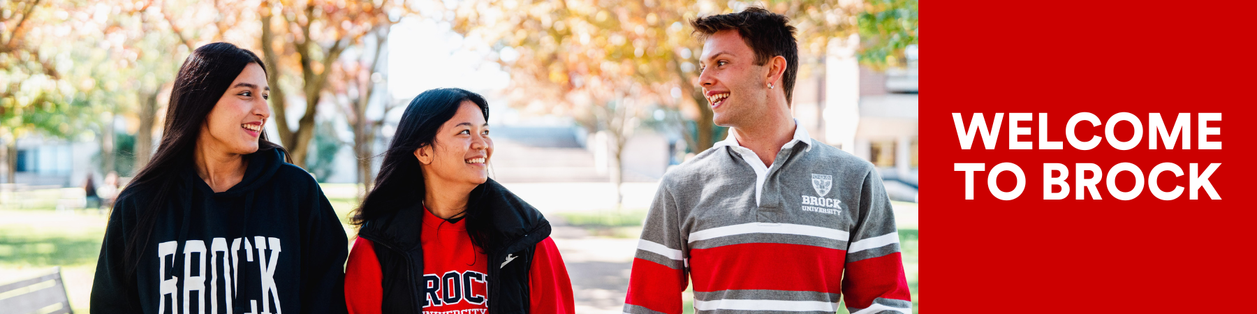 Three Brock Students talking together with the text "Welcome to Brock"
