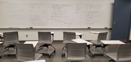 classroom with chemistry written on the board