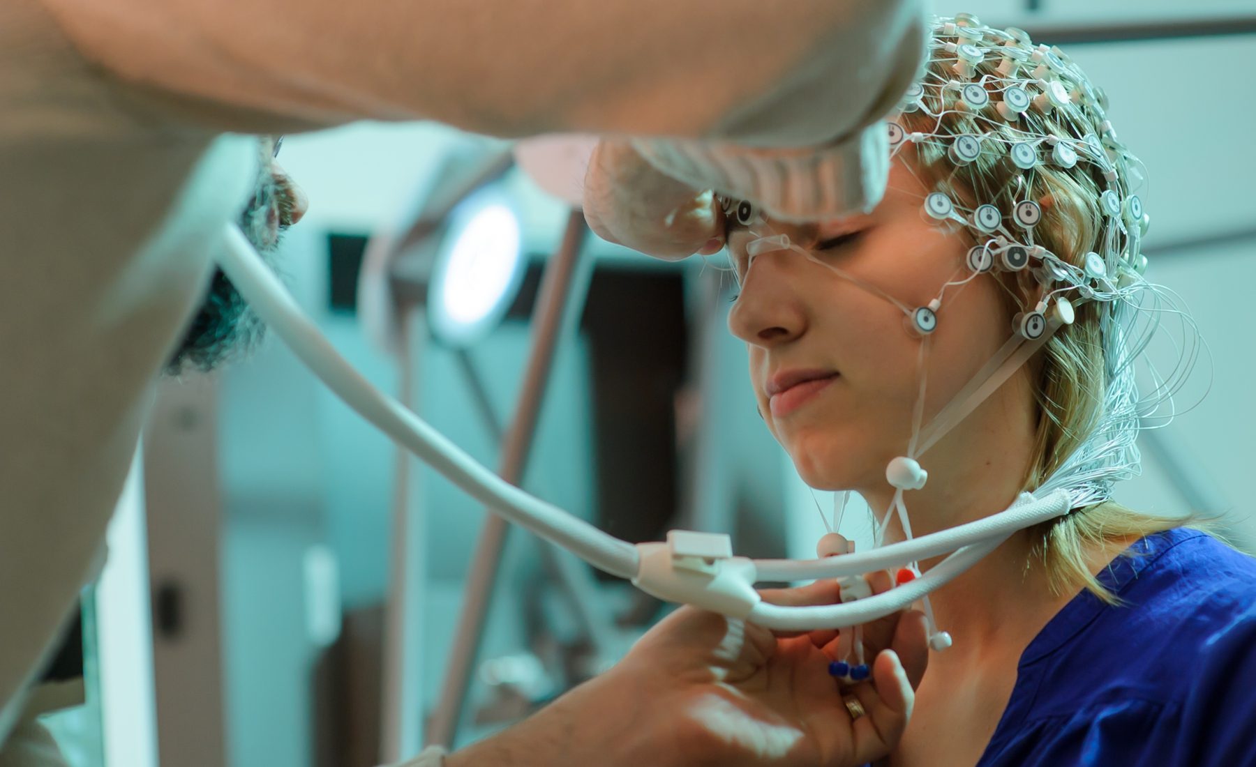 student with headpiece on for psychology research