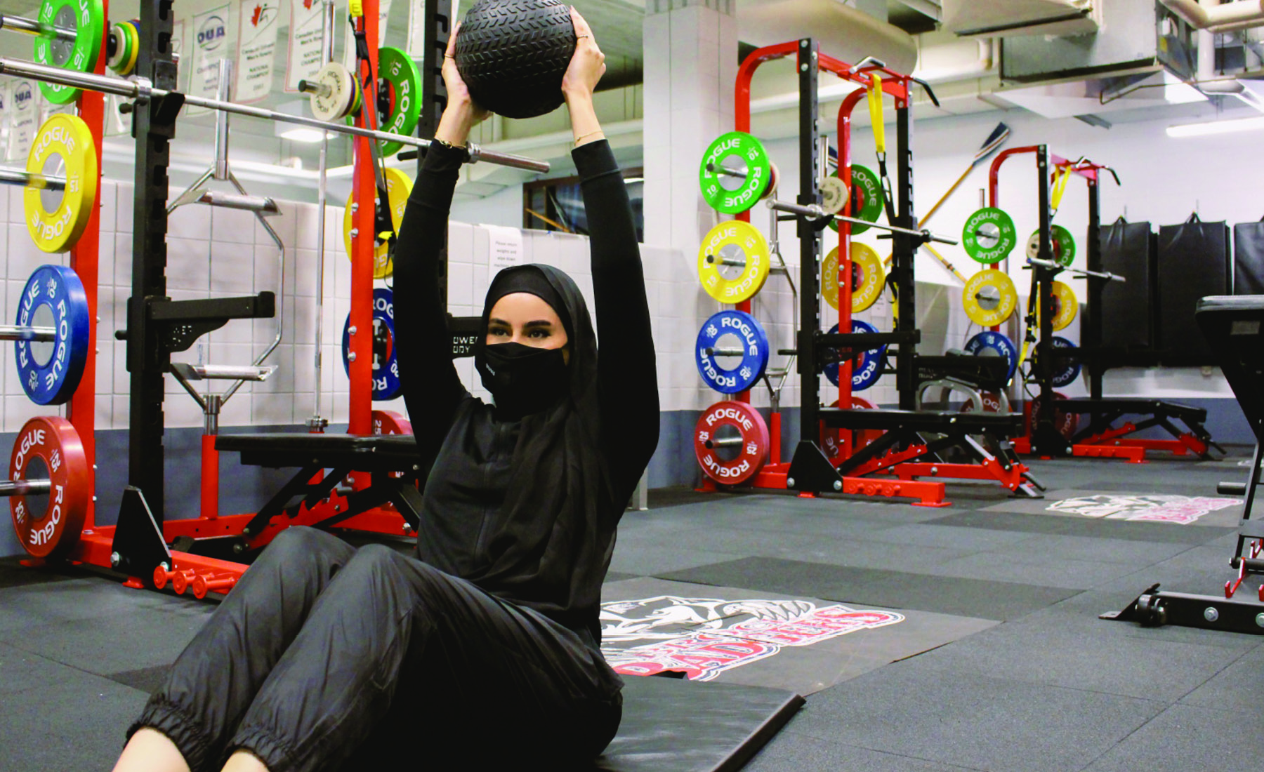 Woman in a hijab working out 