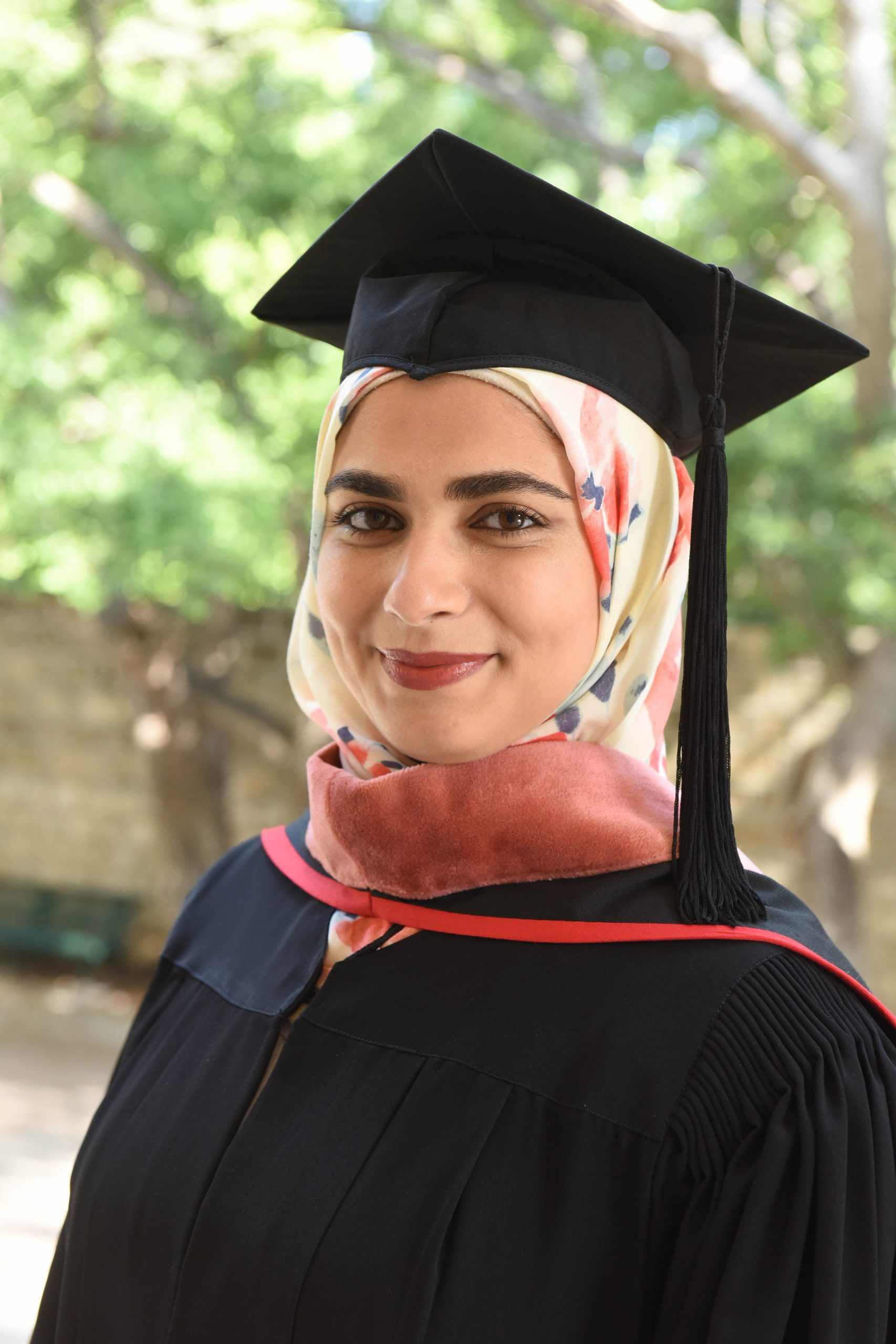 Rawan El Haj in academic regalia.